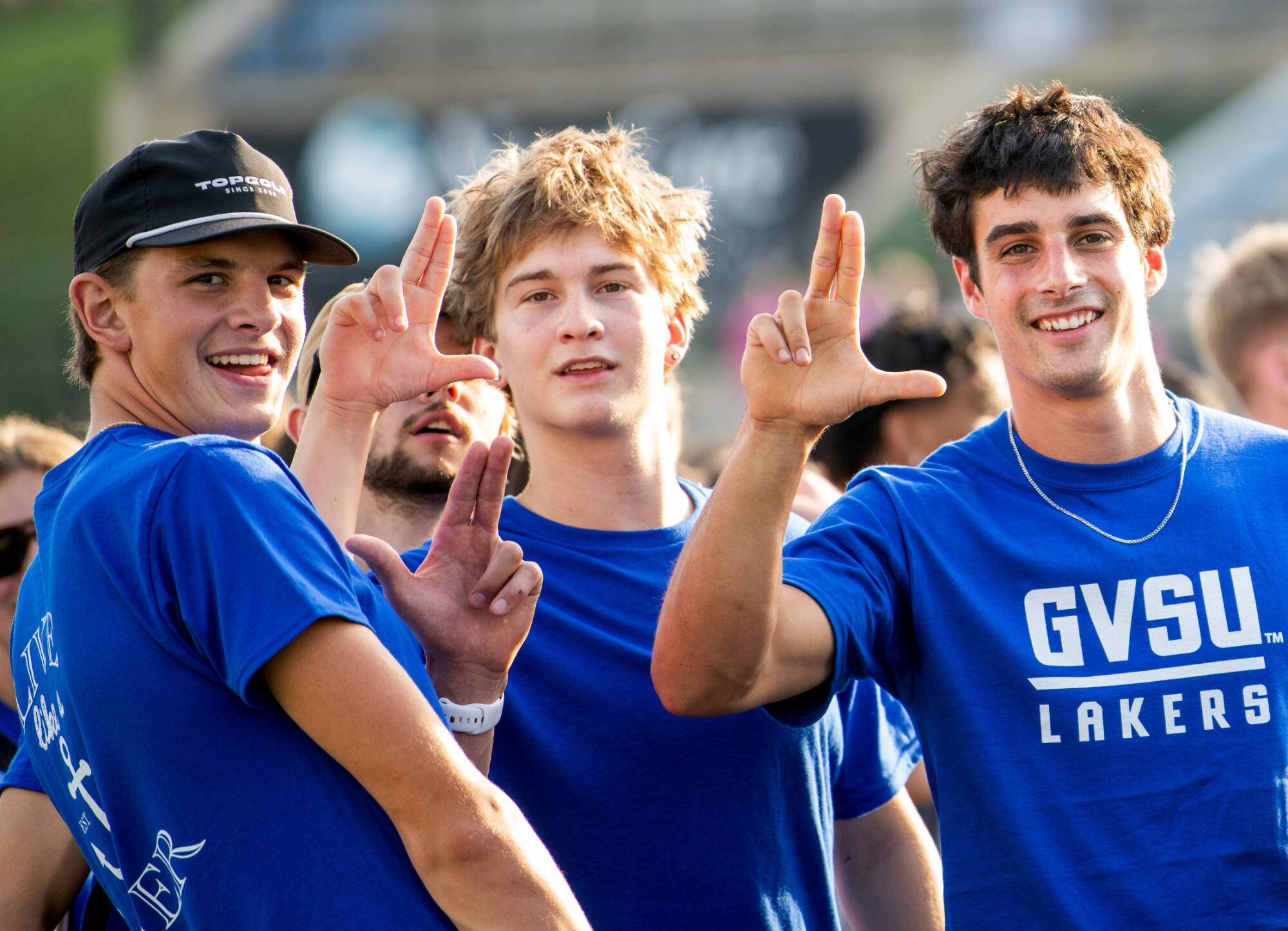 students holding up "Anchor Up' hand sign